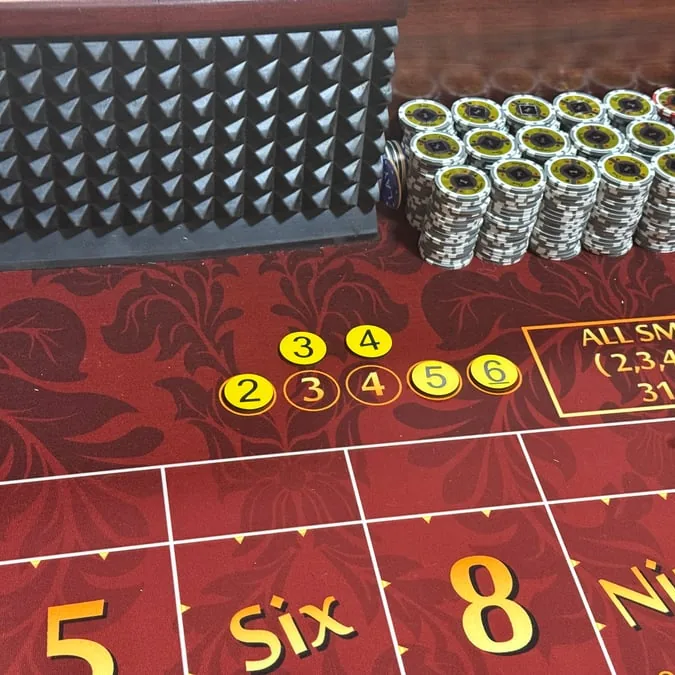 Yellow ATS bonus buttons on a craps layout